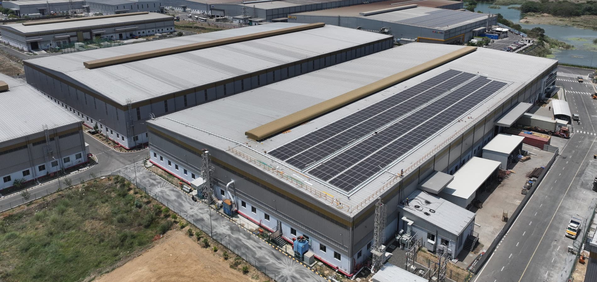 Aerial view of Greenbase industrial buildings with rooftop solar panels