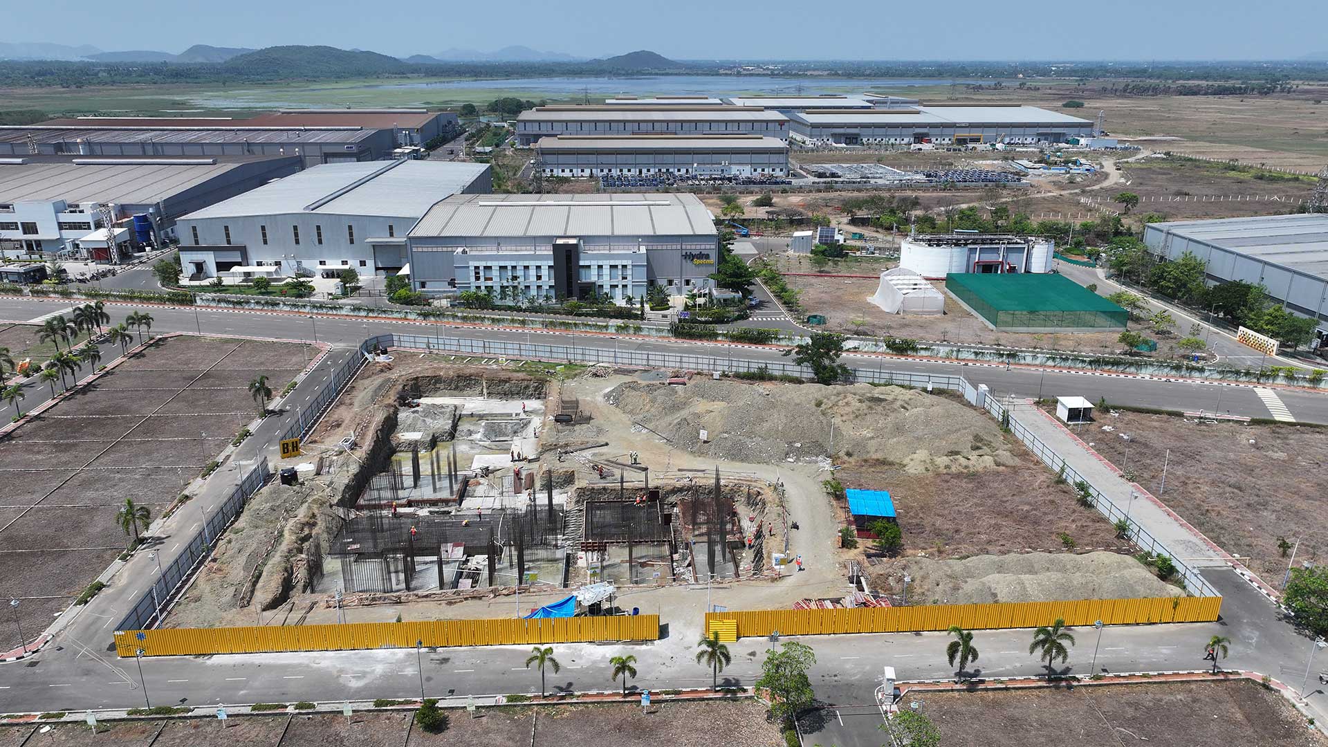 Aerial view of active development and operating facilities at a Greenbase industrial park